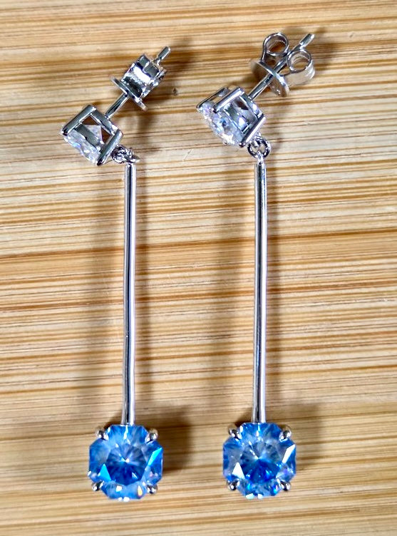 8ctw Moissanite pendulum earrings, with 3ct octagonal frosty aquamarine Moissanites at the bottom of the pendulum, and 1ct white round brilliant Moissanites at the top! Full Argentium silver construction with sterling silver disk backs! An HKJ exclusive!