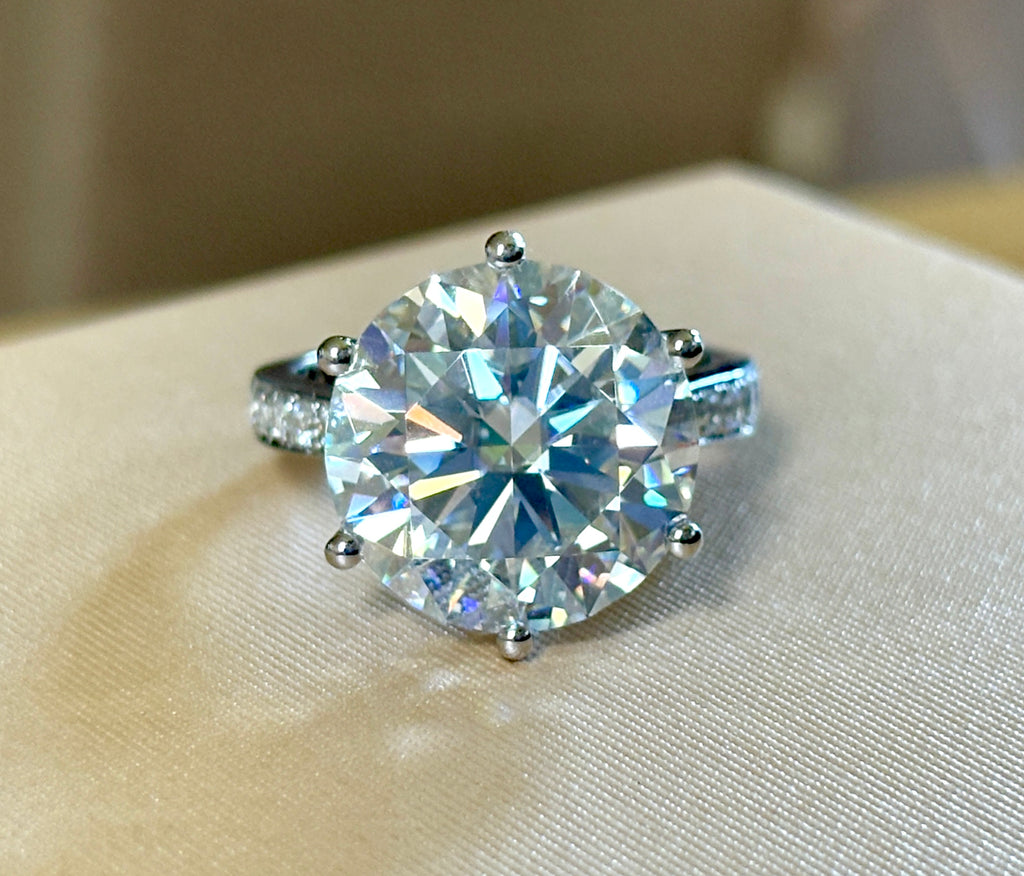 Moissanite ring. The 10ct certified 8H8A Moissanite “Tulip” statement ring with .50cttw Moissanite accents! Photos fail this GORGEOUS ring!