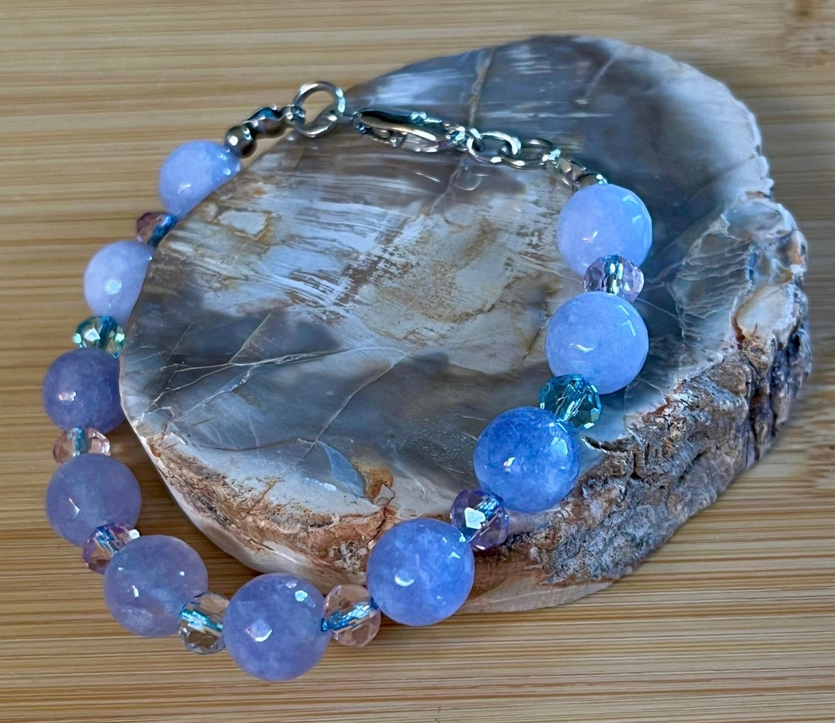 Aquamarine bracelets and/or earrings. Faceted 10mm aquamarines with your choice of crystal or stainless steel station beads and stainless steel color!