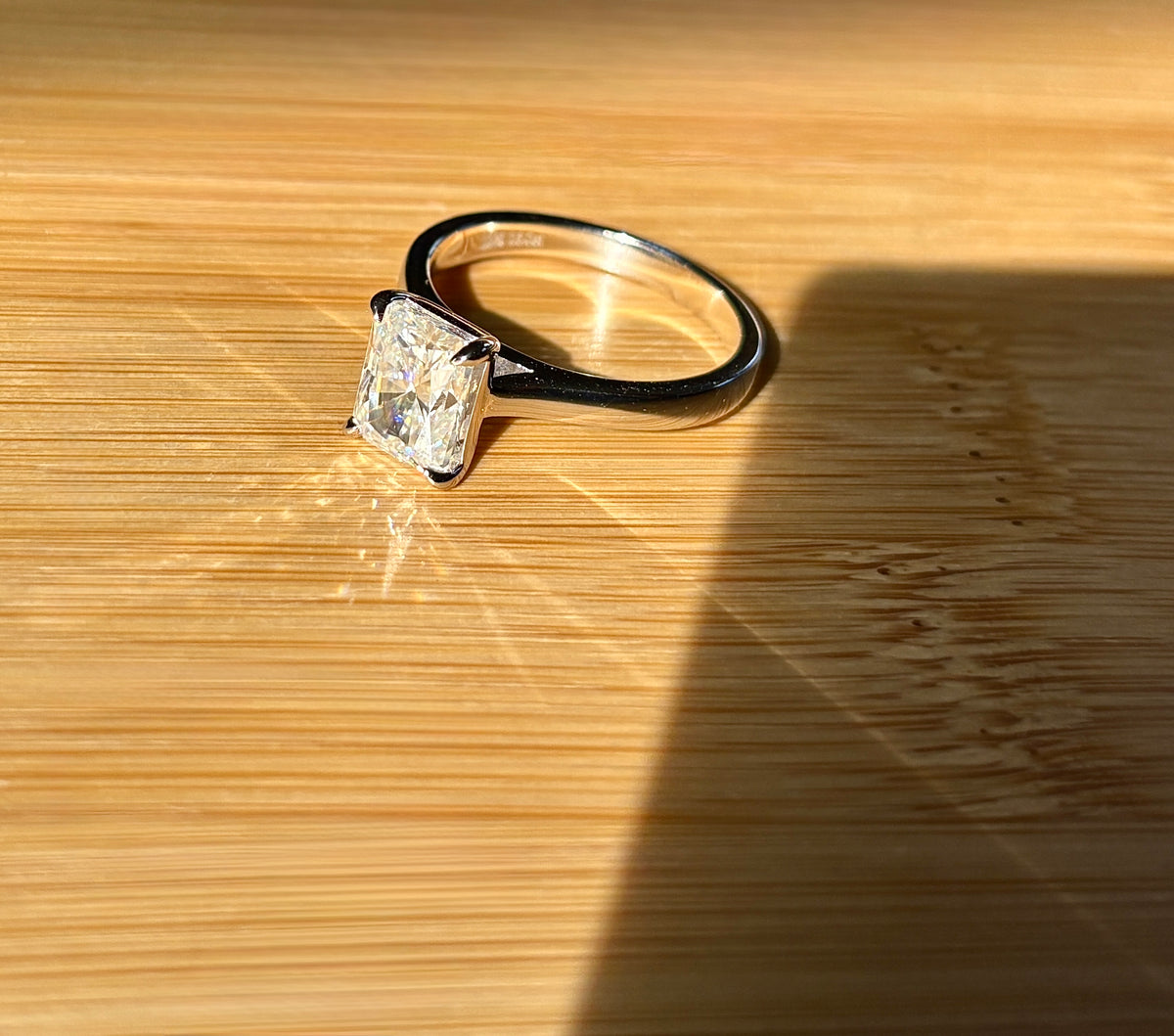 A certified Moissanite 3ct radiant solitaire! An UBER flashy, ULTRA classy, contemporary and chic radiant-cut engagement ring!