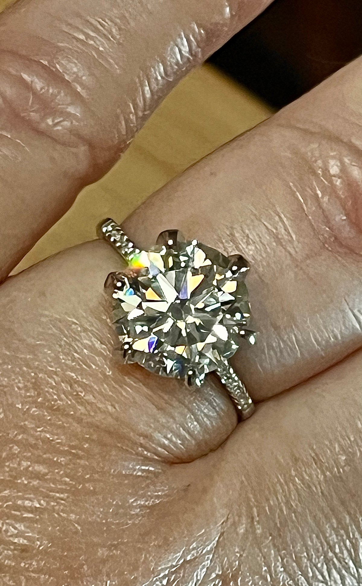 Moissanite ring. A certified 5ct Moissanite solitaire with zircon-accented shoulders, set in sterling silver and bathed in 18k!