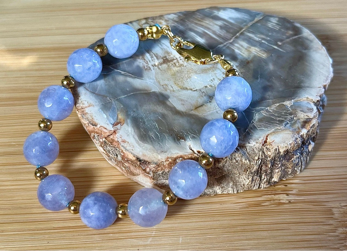 Aquamarine bracelets and/or earrings. Faceted 10mm aquamarines with your choice of crystal or stainless steel station beads and stainless steel color!