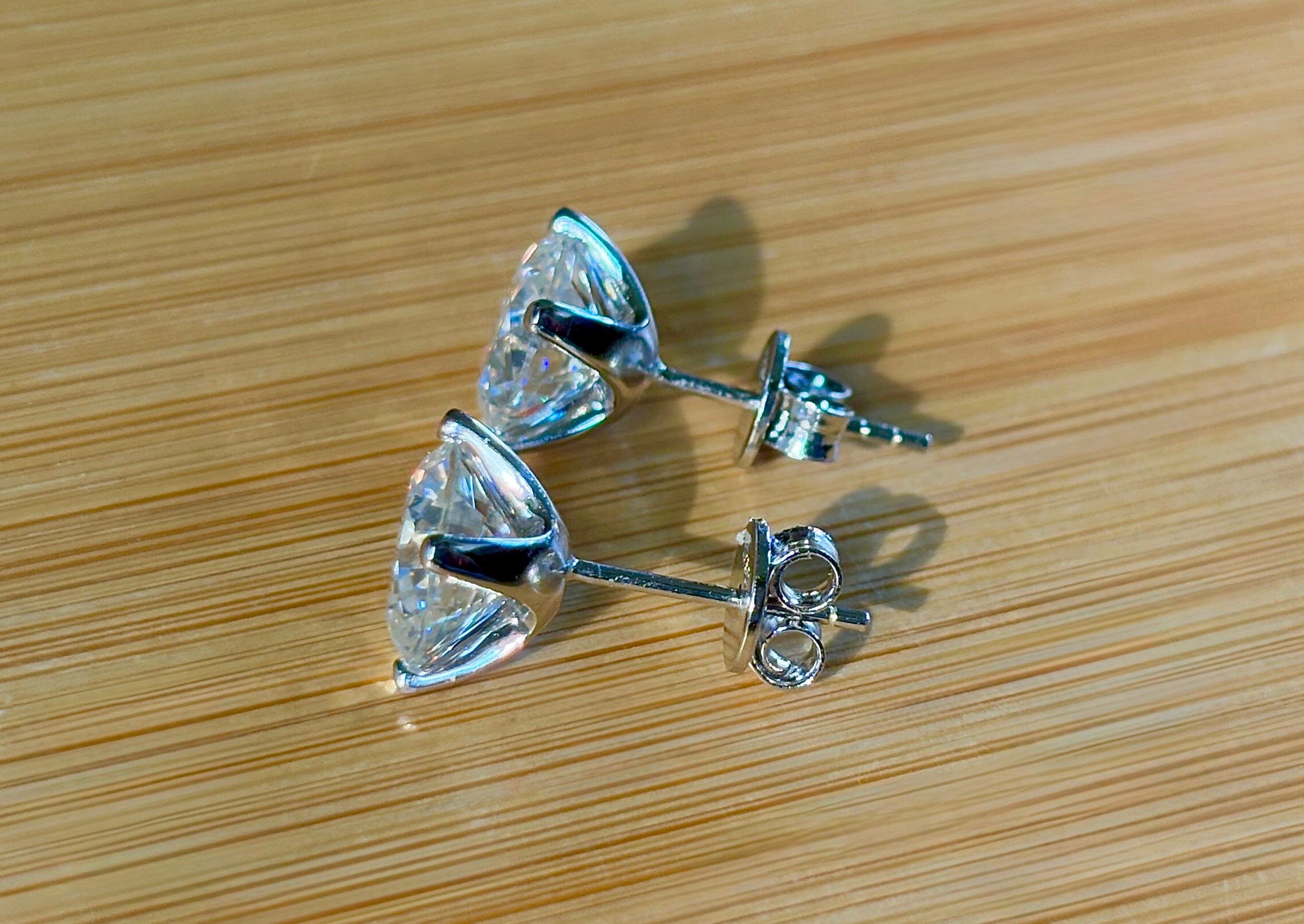 Moissanite earrings. A 6cttw certified pair of high-end boutique-quality Moissanite studs in my sturdy sterling and 18k 4-claw mountings!