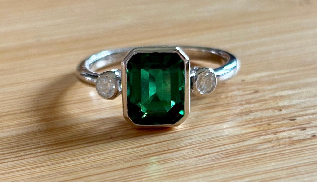 Emerald and Moissanite ring. A certified 2ct lab-grown emerald-cut Zambian emerald and .20cttw Moissanite ring! Exclusive to my shop!