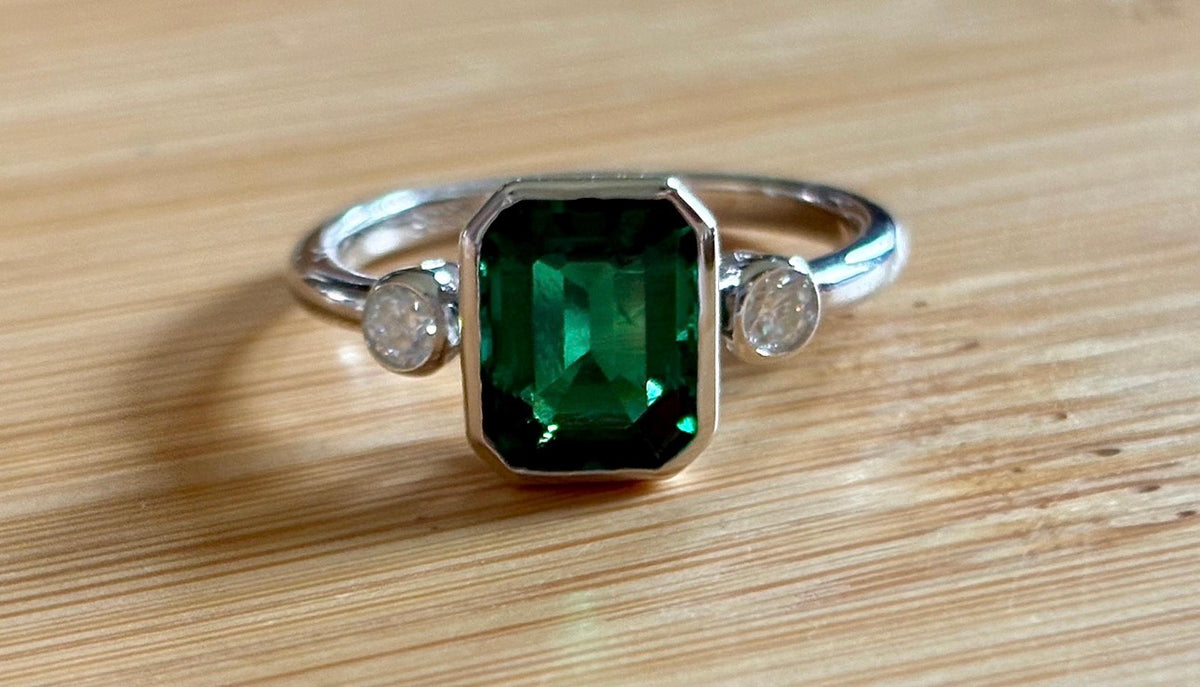 Emerald and Moissanite ring. A certified 2ct lab-grown emerald-cut Zambian emerald and .20cttw Moissanite ring! Exclusive to my shop!