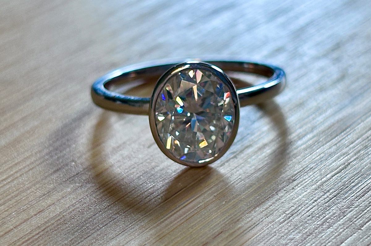 Moissanite ring. A 3ct oval in a hybrid basket + bezel of sterling OR Argentium silver! A Hand Knotted Jewelry EXCLUSIVE!