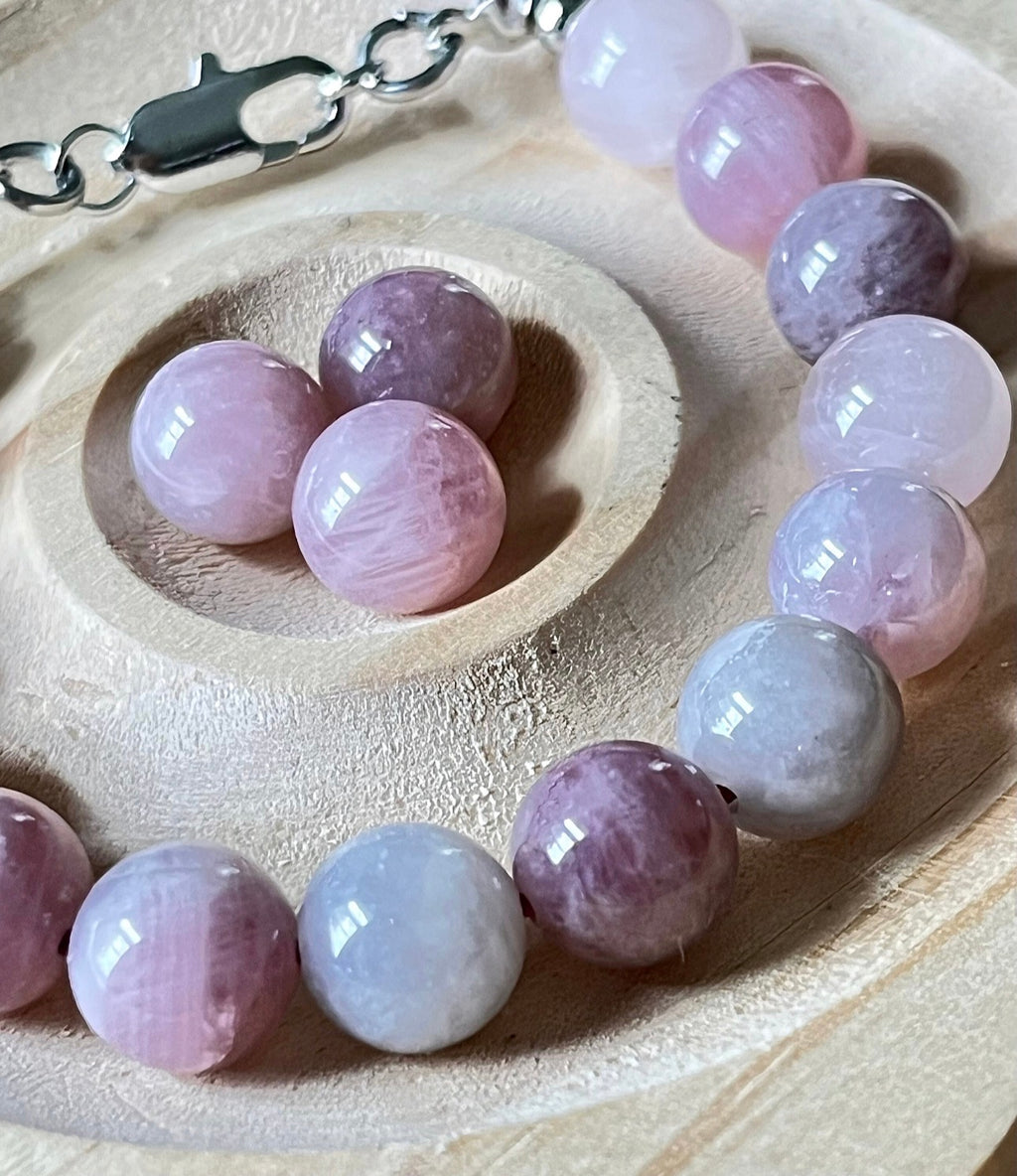 Madagascar rose quartz bracelet. Hands-down GORGEOUS AAA-grade 10.5mm purple-pink rose quartz beads and with varying degrees of crystallization and color!