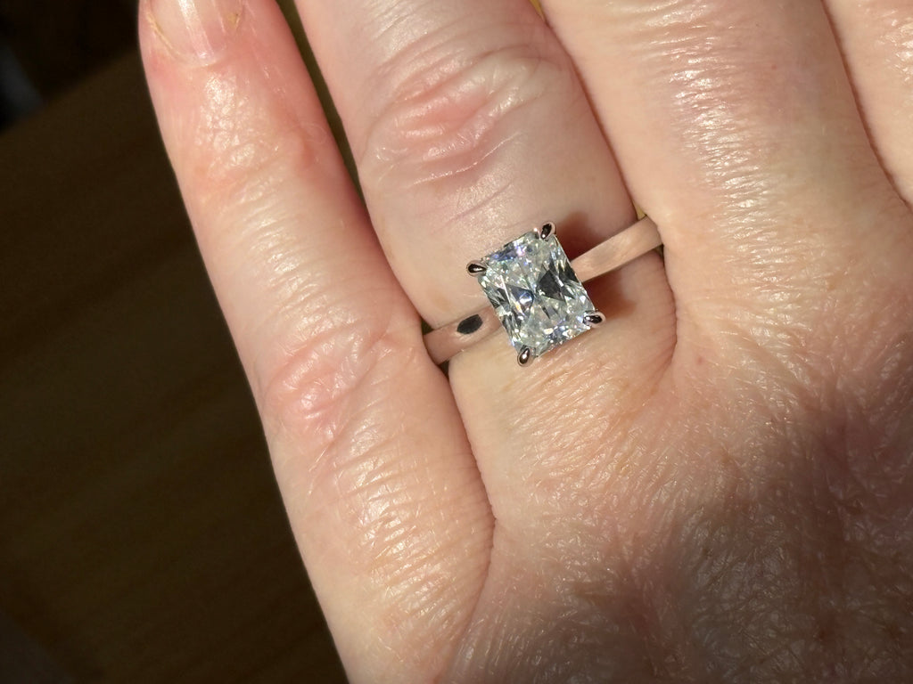 A certified Moissanite 3ct radiant solitaire! An UBER flashy, ULTRA classy, contemporary and chic radiant-cut engagement ring!