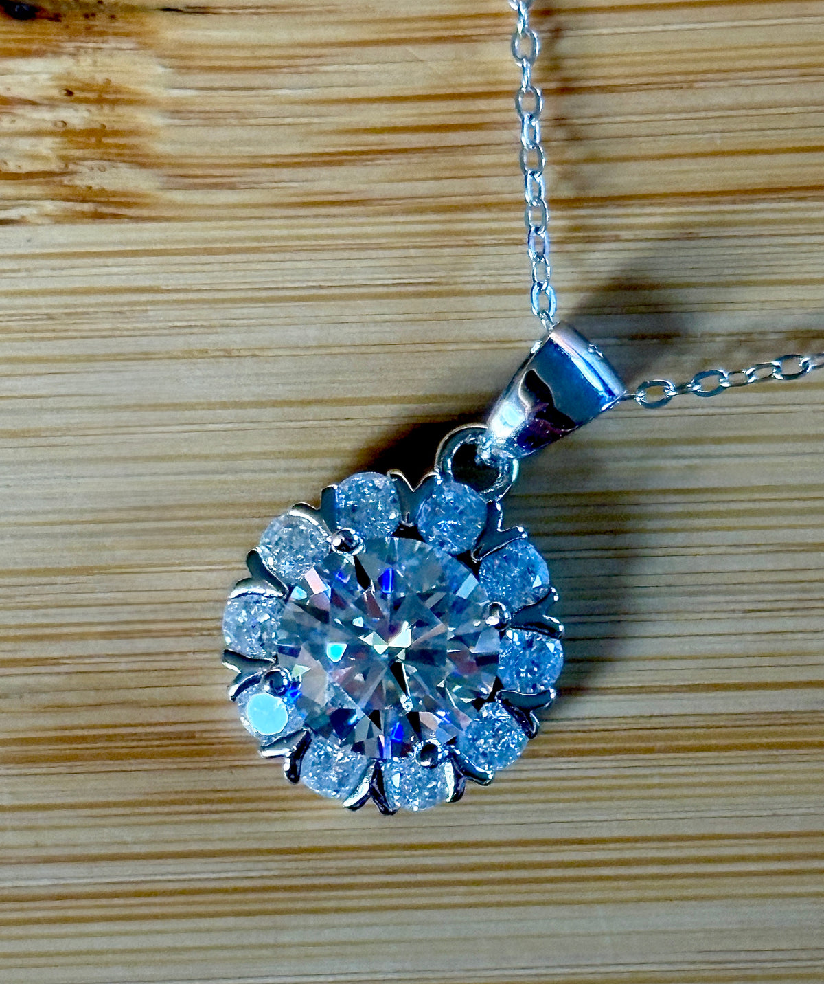 Moissanite necklace. A 3ct certified round brilliant Moissanite in a snowflake-shaped pendant ! A perfect piece for the holidays and beyond!