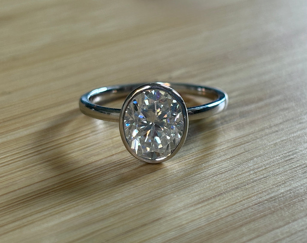 Moissanite ring. A 3ct oval in a hybrid basket + bezel of sterling OR Argentium silver! A Hand Knotted Jewelry EXCLUSIVE!