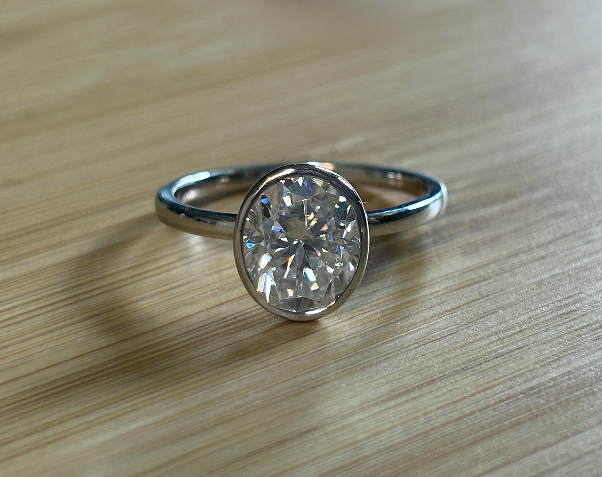 Moissanite ring. A 3ct oval in a hybrid basket + bezel of sterling OR Argentium silver! A Hand Knotted Jewelry EXCLUSIVE!