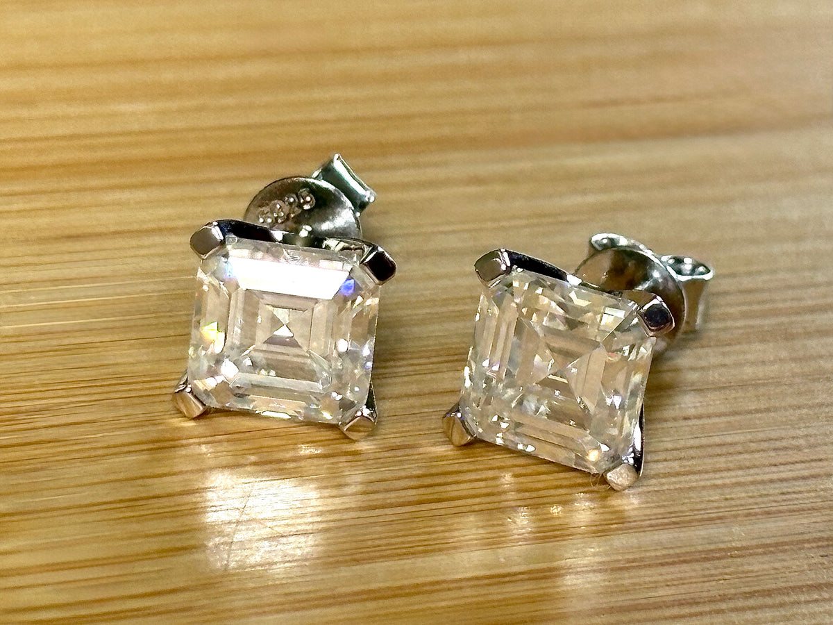 Moissanite studs. A 6.4ctw *perfect* pair of DOUBLE certified Asscher-cut Moissanites in my custom 4-claw 935 ARGENTIUM silver mountings! Opulent!
