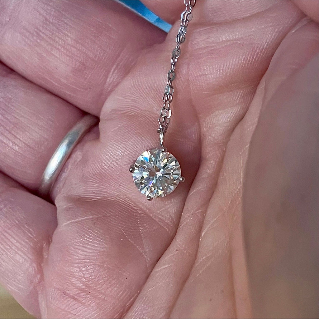 2ct Moissanite solitaire necklace. A 2ct “Floating Moissanite” in sterling silver creates the illusion of being suspended by nothing more than spider silk!