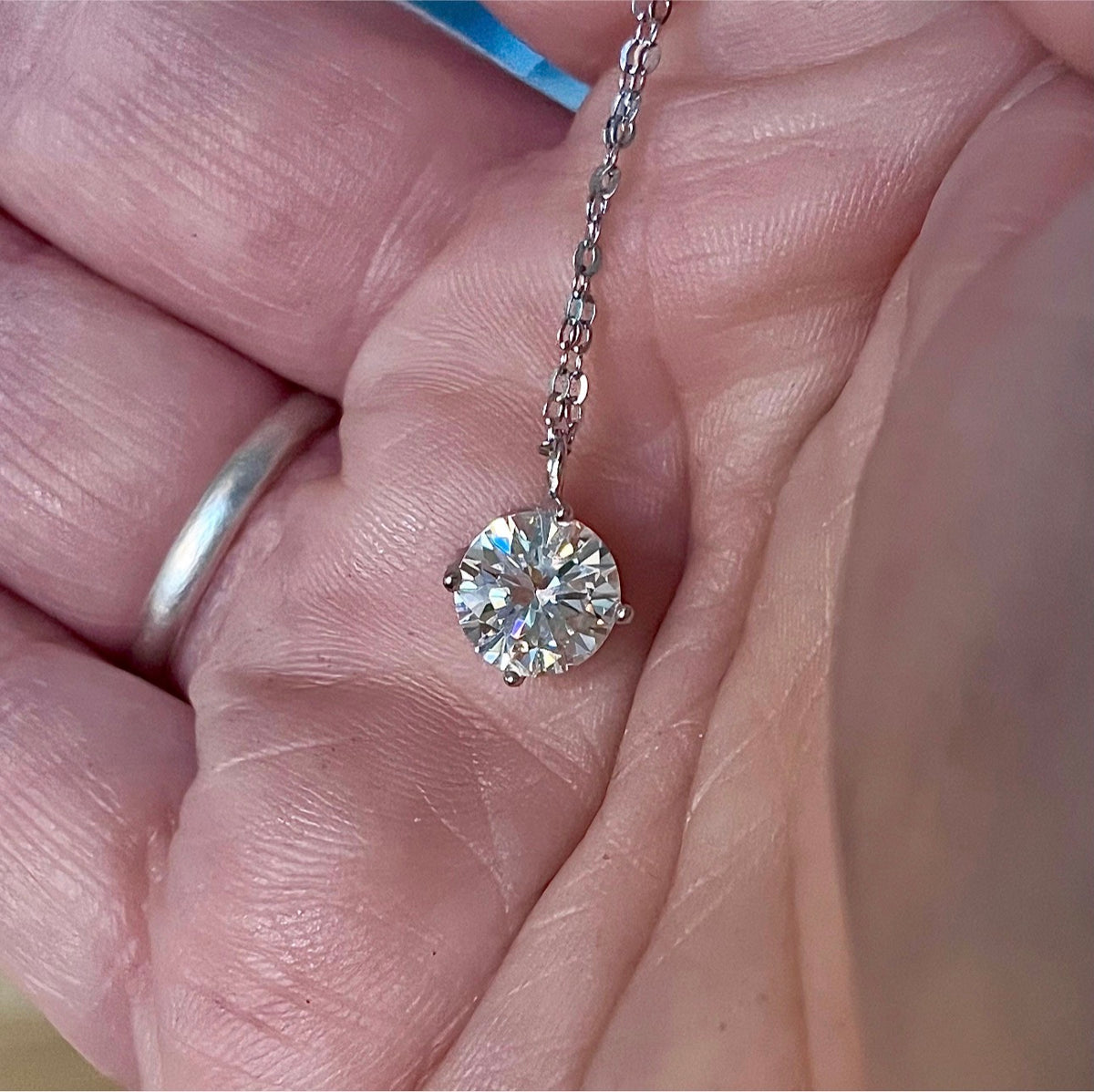 2ct Moissanite solitaire necklace. A 2ct “Floating Moissanite” in sterling silver creates the illusion of being suspended by nothing more than spider silk!