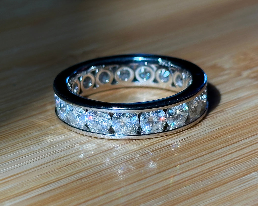 Moissanite ring. A 5.10cttw or 4.8cttw (depending on size) Moissanite eternity ring. A channel-set, classy and classic design - beautiful!