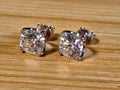 6ctw cushion-cut Moissanite studs in elegant sterling silver double-claw mountings! With brilliant faceting, these earrings are showstoppers!