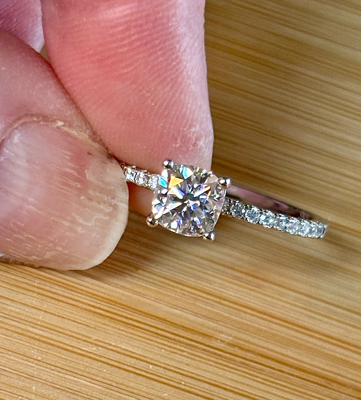 Moissanite solitaire. A certified 1ct cushion-cut Moissanite with pavé-set zircons in 925 sterling OR pavé-set Moissanites in 935 Argentium!