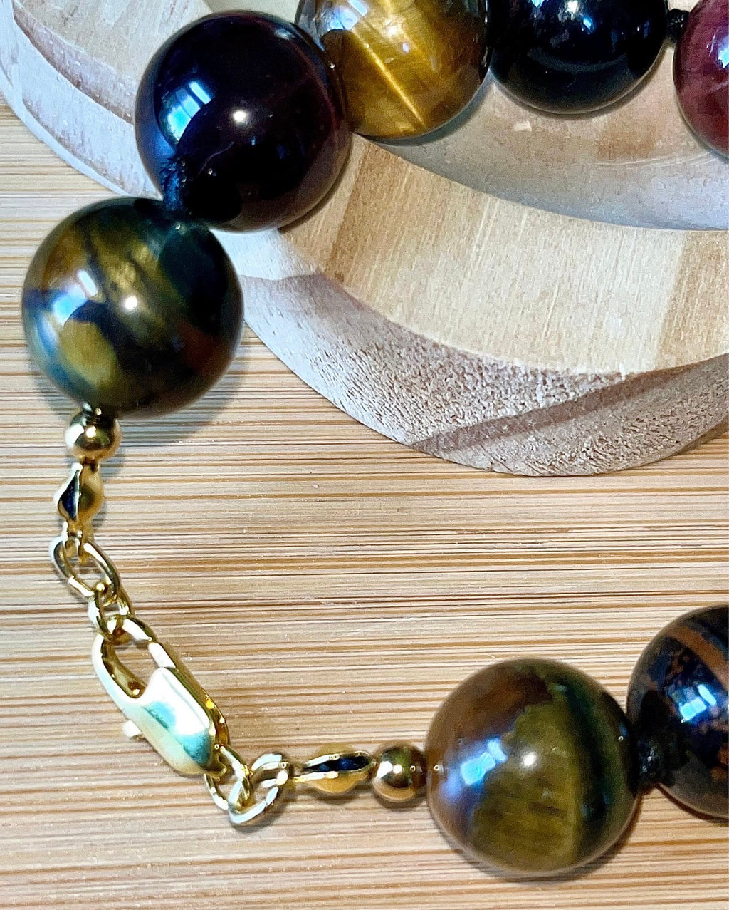 Tiger’s eye bracelet. 100% natural, highly chatoyant 14mm tricolored tiger’s eye hand knotted bracelet! Also available without the knots!