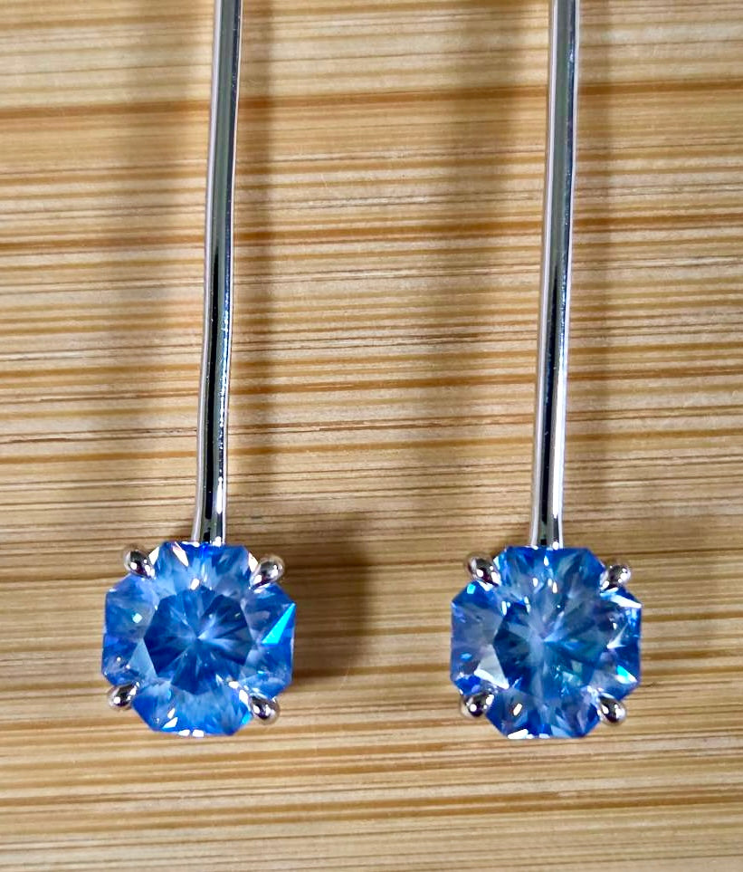 8ctw Moissanite pendulum earrings, with 3ct octagonal frosty aquamarine Moissanites at the bottom of the pendulum, and 1ct white round brilliant Moissanites at the top! Full Argentium silver construction with sterling silver disk backs! An HKJ exclusive!