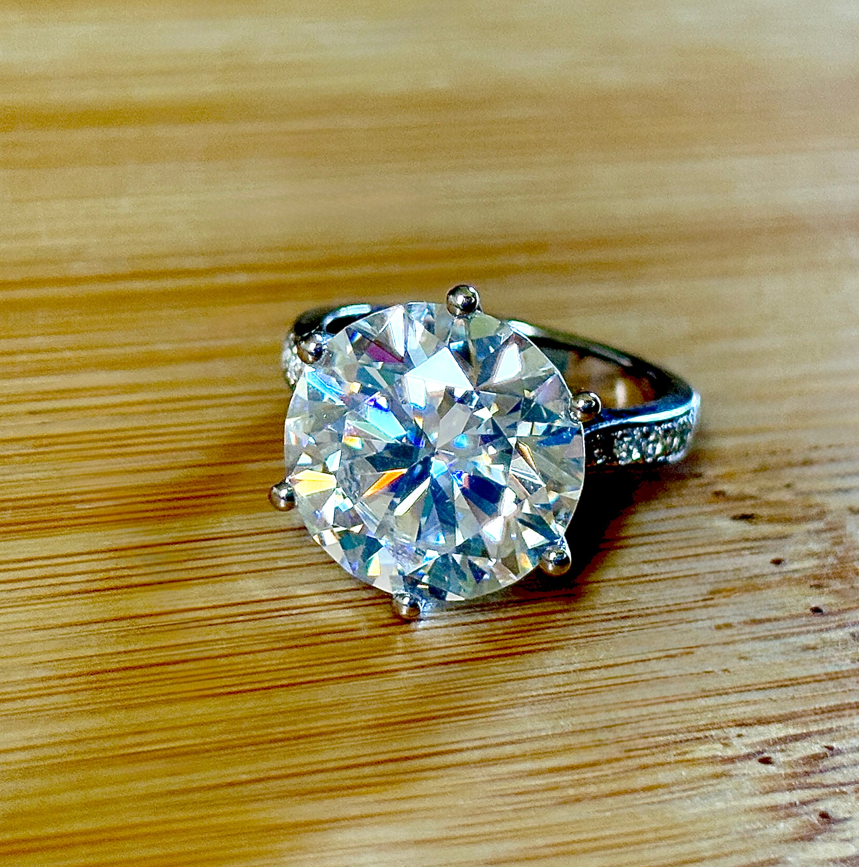 Moissanite ring. The 10ct certified 8H8A Moissanite “Tulip” statement ring with .50cttw Moissanite accents! Photos fail this GORGEOUS ring!
