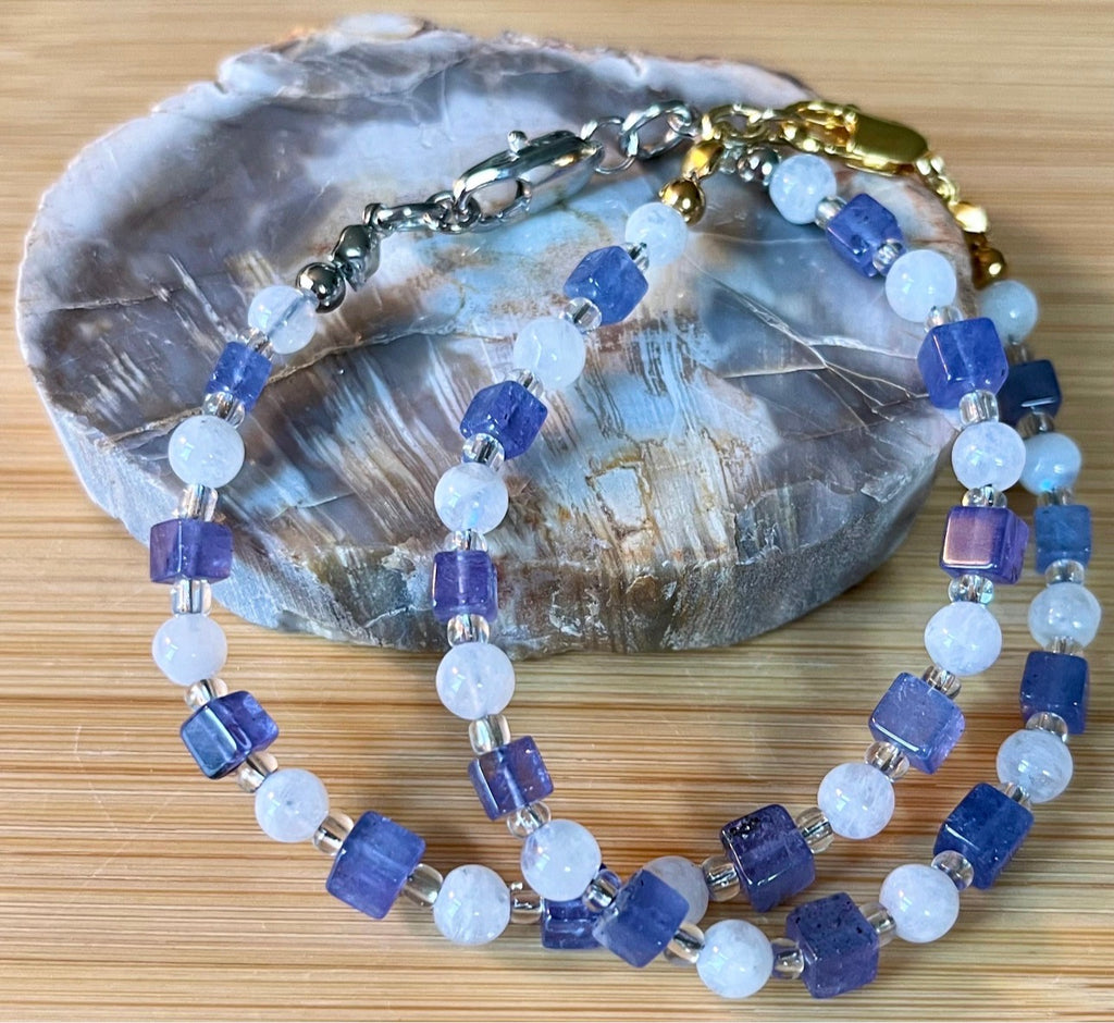 Moonstone and tanzanite bracelet. Dusky tanzanite cubes and round moonstones on stainless steel jeweler’s wire! Pretty and petite!