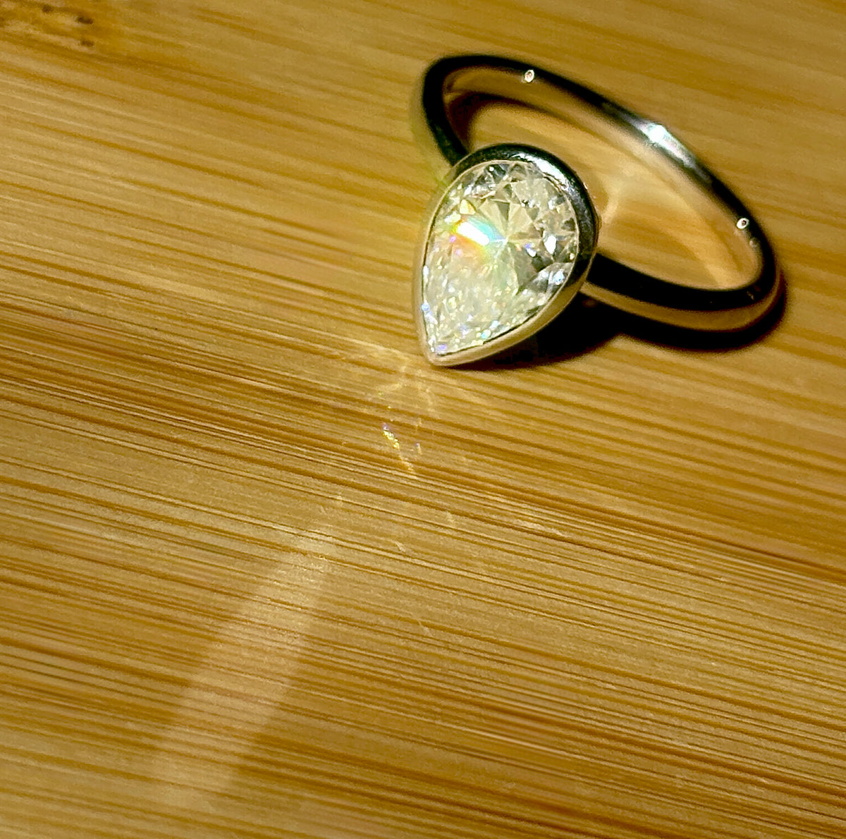 Moissanite ring. A certified 3ct pear in a hybrid basket + bezel of 925 sterling or 935 Argentium silver! A Hand Knotted Jewelry EXCLUSIVE!