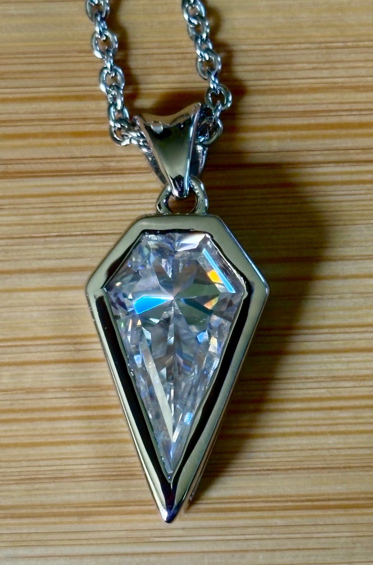 Moissanite necklace. “Flight!”, a kite-shaped, custom-cut 5ct Moissanite pendant! Hand-faceted by a master stone cutter and set in Argentium silver, it is suspended on a 20” sterling silver chain and is exclusive to Hand Knotted Jewelry!