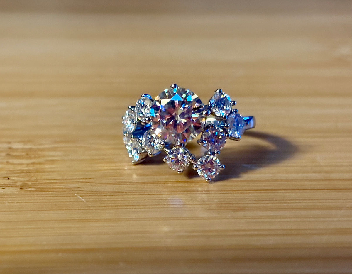 Moissanite ring. The “Moissanite Galaxy” ring features a 3ct certified Moissanite amid a 4cttw Moissanite constellation  - a 7cttw ring!