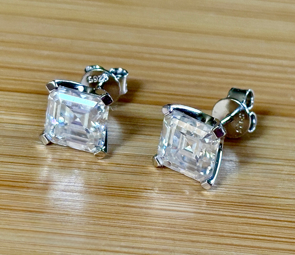 Moissanite studs. A 6.4ctw *perfect* pair of DOUBLE certified Asscher-cut Moissanites in my custom 4-claw 935 ARGENTIUM silver mountings! Opulent!