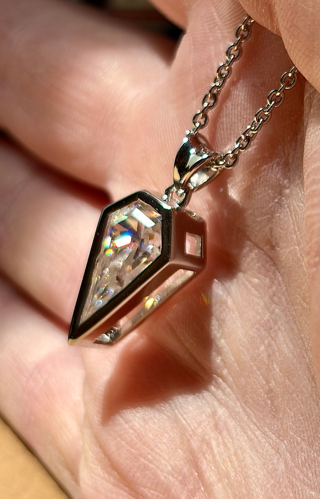 Moissanite necklace. “Flight!”, a kite-shaped, custom-cut 5ct Moissanite pendant! Hand-faceted by a master stone cutter and set in Argentium silver, it is suspended on a 20” sterling silver chain and is exclusive to Hand Knotted Jewelry!