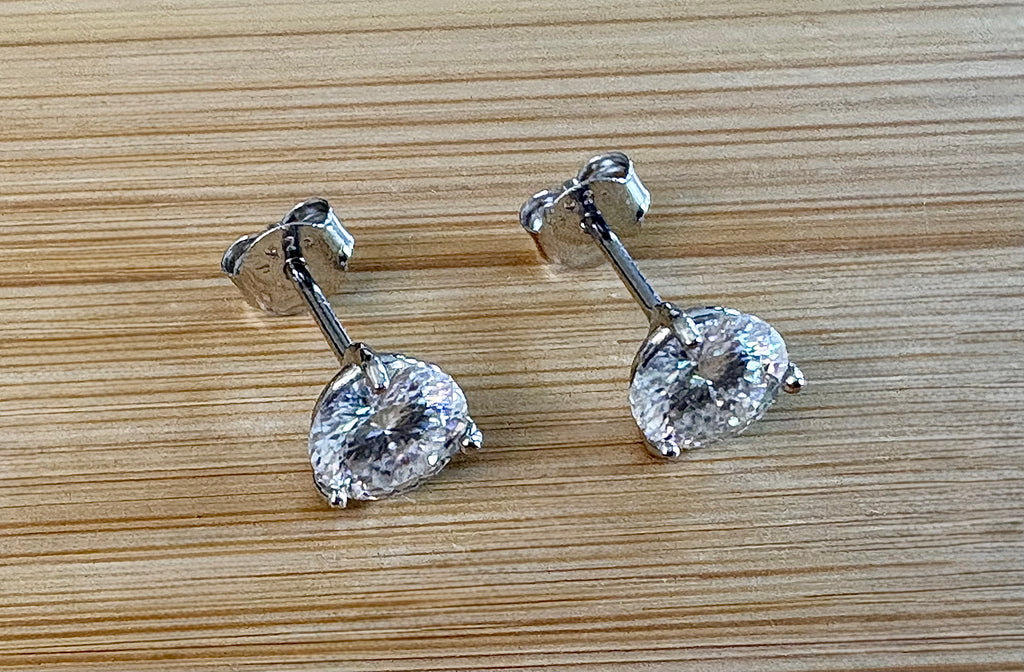 Moissanite studs. A 100-facet 2cttw pair of super bright, DOUBLE certified Moissanite studs in sterling silver and 18k white rhodium! Sublime!