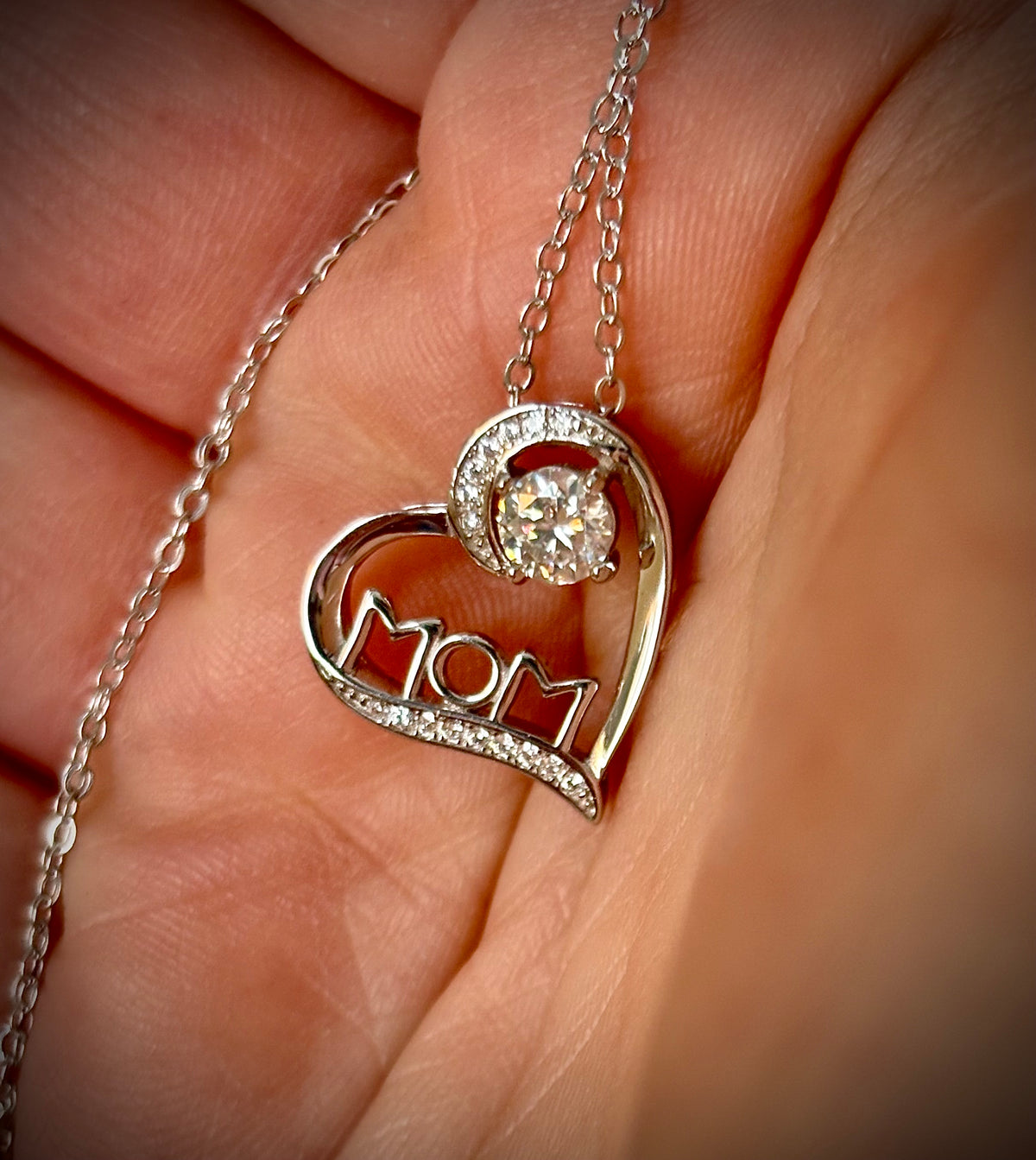 Moissanite necklace. A certified 1/2ct round radiant Moissanite in a pendant just for your mom or because you’re a mom, in sterling silver with zircon accents!