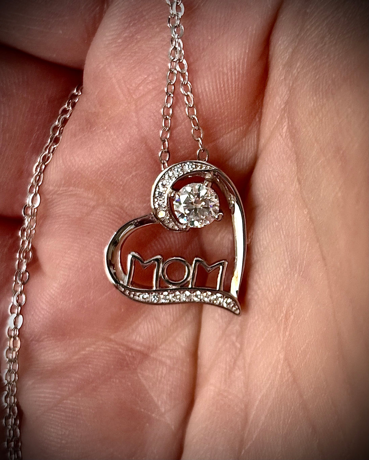 Moissanite necklace. A certified 1/2ct round radiant Moissanite in a pendant just for your mom or because you’re a mom, in sterling silver with zircon accents!