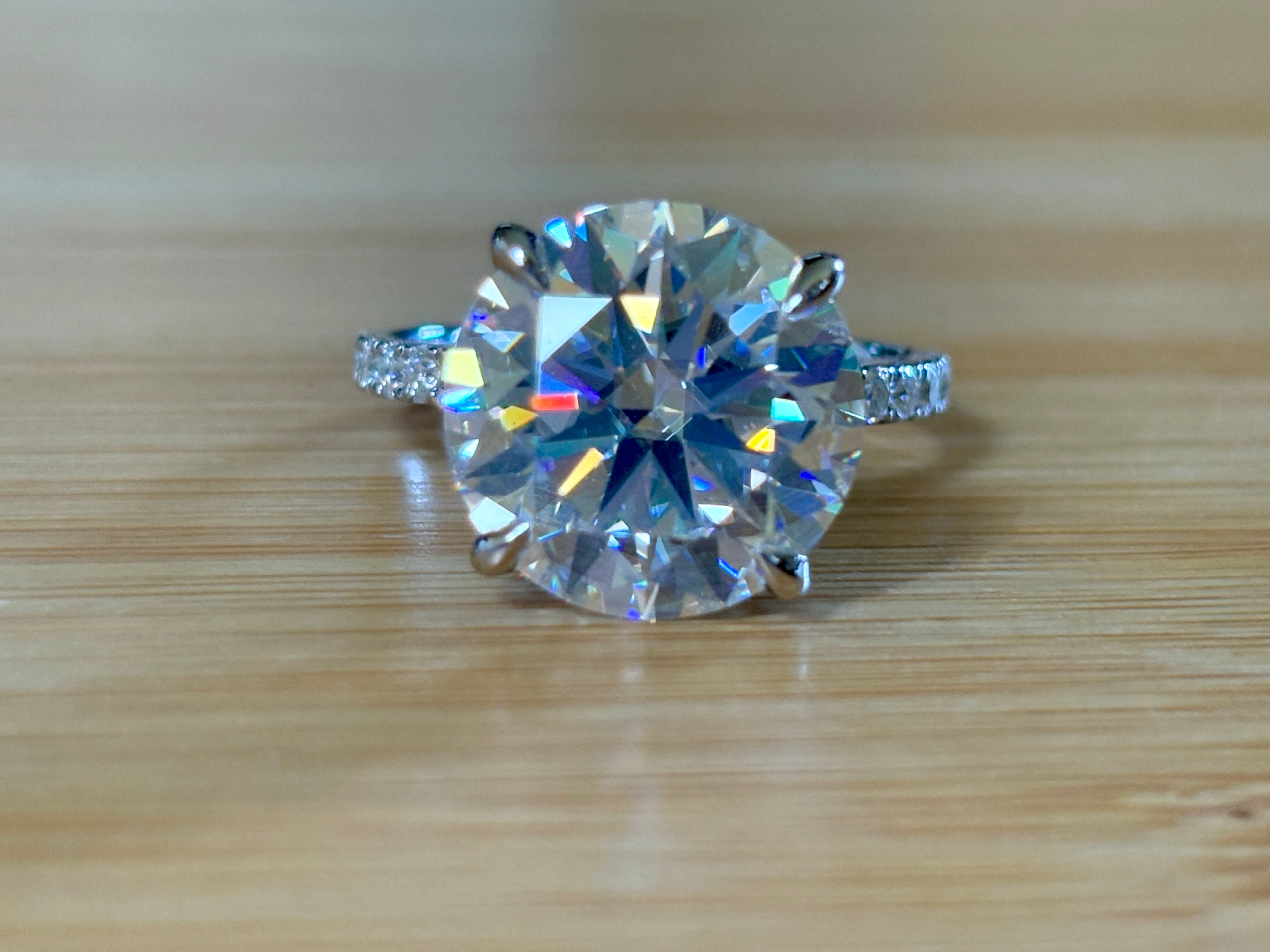 Moissanite solitaire. A glorious 10ct 8H8A Moissanite in a 4-prong mounting with a Moissanite “hidden halo” and shoulders, an 11.3cttw ring!