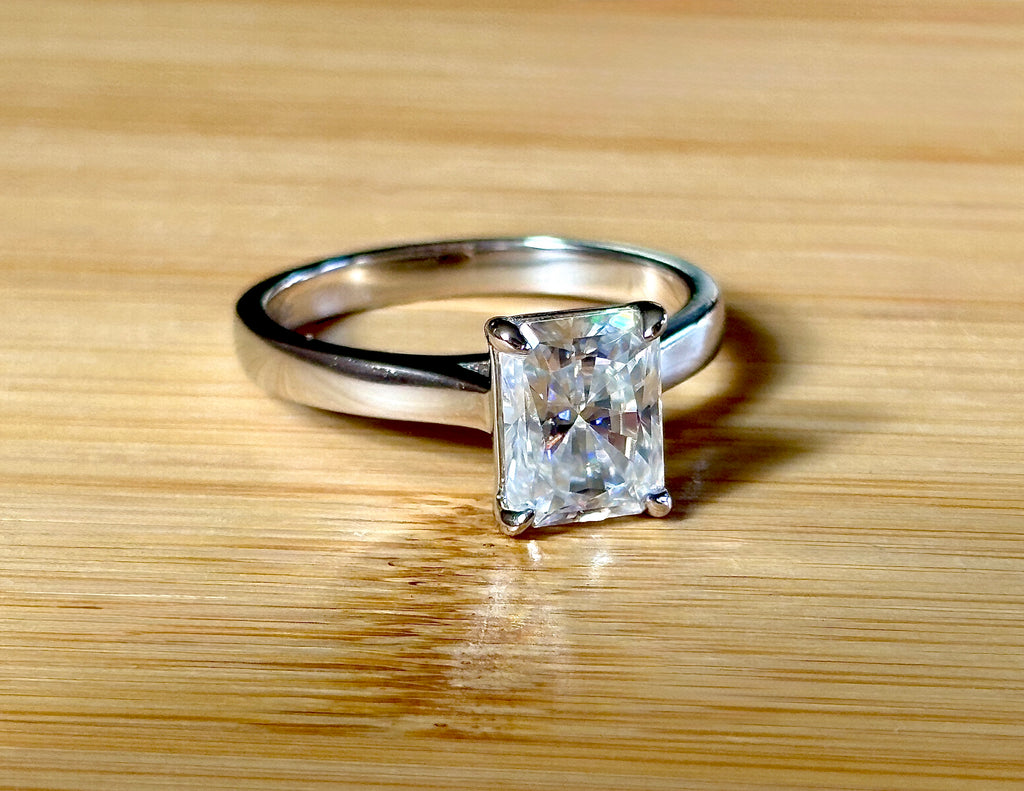 A certified Moissanite 3ct radiant solitaire! An UBER flashy, ULTRA classy, contemporary and chic radiant-cut engagement ring!