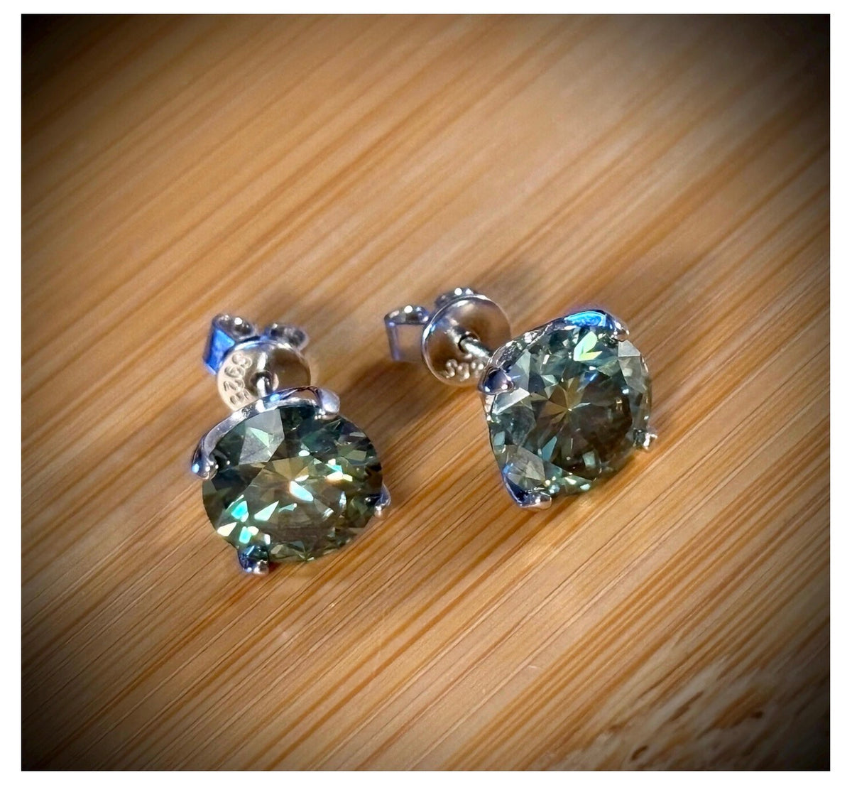 Moissanite studs. A 2cttw or 6cttw pair of cyan (greenish-blue) Moissanite studs. Double certified and rich in color, they are delicious!