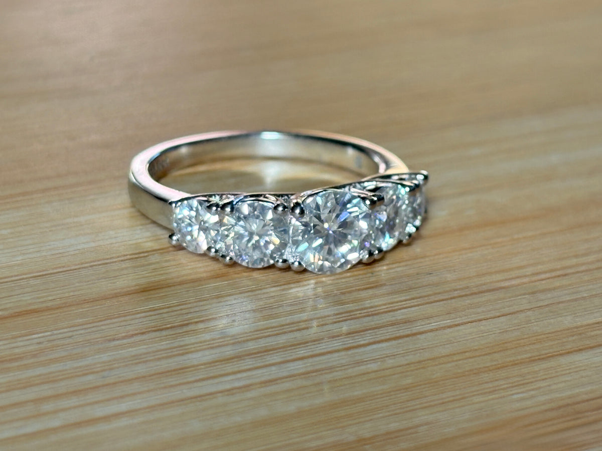 Moissanite ring. A 2.5ctw certified Moissanite ring, for those who want plenty of sparkle but a daintier ring! This feminine 5-stone design is just the thing!