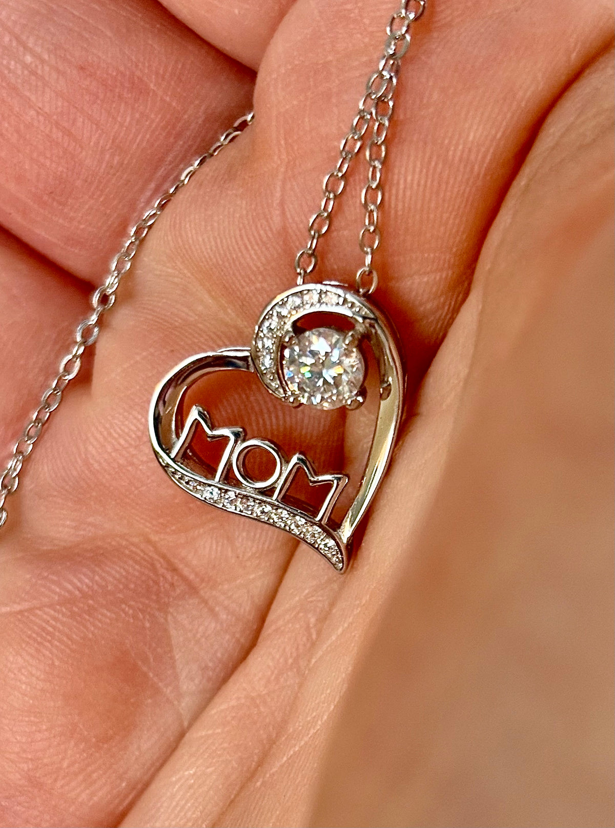 Moissanite necklace. A certified 1/2ct round radiant Moissanite in a pendant just for your mom or because you’re a mom, in sterling silver with zircon accents!