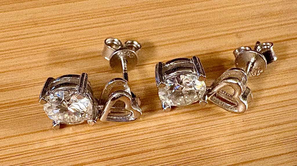 Moissanite earrings. Certified 2cttw round brilliant Moissanites dangling from heart-shaped posts are perfect for your Valentine (or you)!