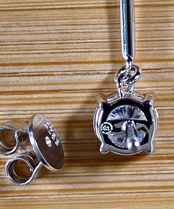 8ctw Moissanite pendulum earrings, with 3ct octagonal frosty aquamarine Moissanites at the bottom of the pendulum, and 1ct white round brilliant Moissanites at the top! Full Argentium silver construction with sterling silver disk backs! An HKJ exclusive!