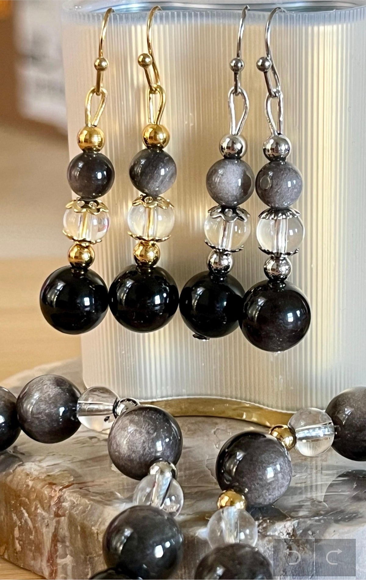 Silver sheen obsidian and clear quartz bracelet and earrings. Pair the “Silver Bells” bracelet and/or earrings with your little black party dress and be the Belle of the Ball!
