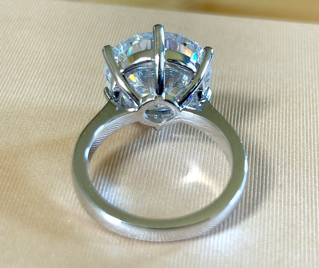 Moissanite ring. The 10ct certified 8H8A Moissanite “Tulip” statement ring with .50cttw Moissanite accents! Photos fail this GORGEOUS ring!
