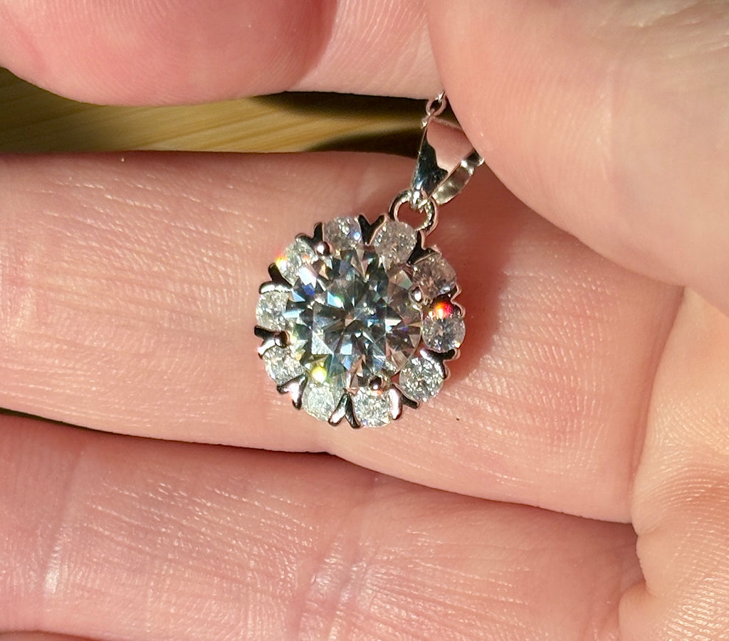 Moissanite necklace. A 3ct certified round brilliant Moissanite in a snowflake-shaped pendant ! A perfect piece for the holidays and beyond!