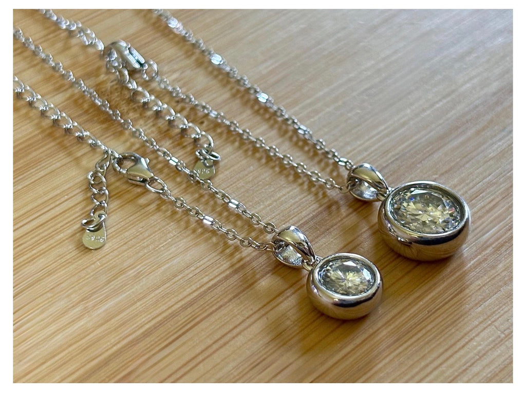 Moissanite necklace. My fiery “bubble bezel” necklace features a 1ct OR 3ct certified Moissanite in a heavy sterling silver bezel setting!
