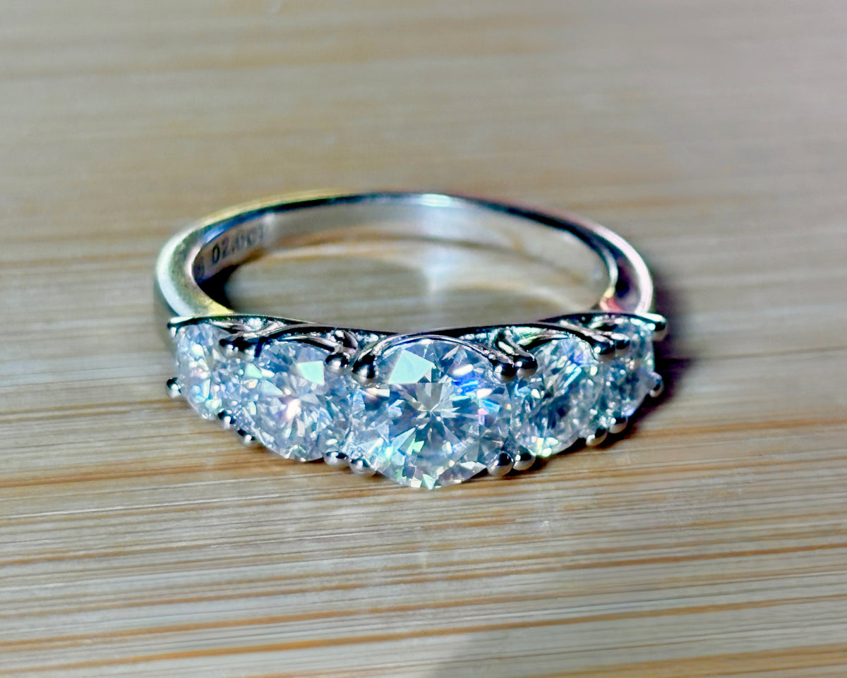 Moissanite ring. A 2.5ctw certified Moissanite ring, for those who want plenty of sparkle but a daintier ring! This feminine 5-stone design is just the thing!