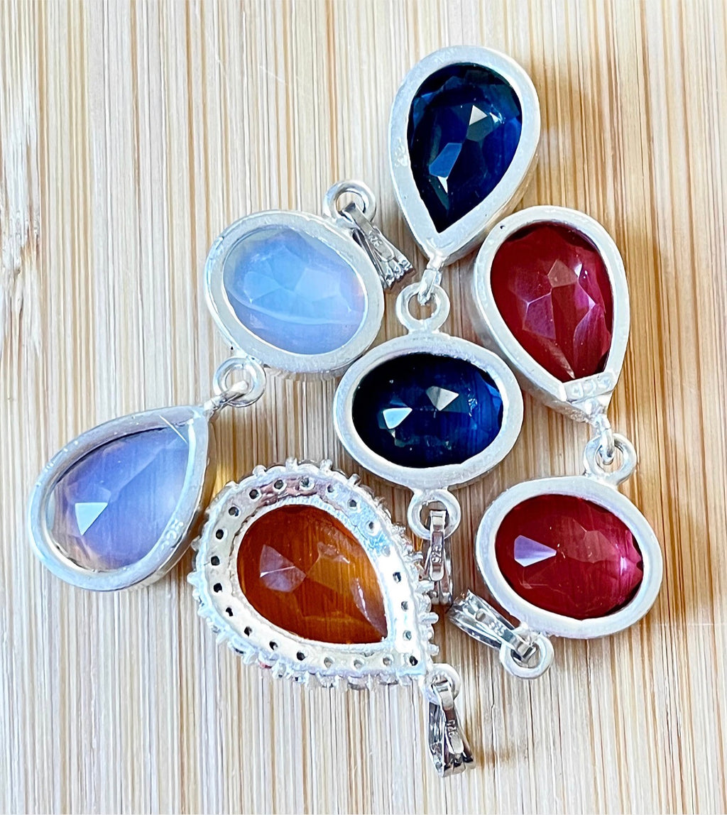 Rubellite tourmaline pendant, citrine pendant, London blue topaz pendant and manmade opal pendant. All solid sterling silver pendants!