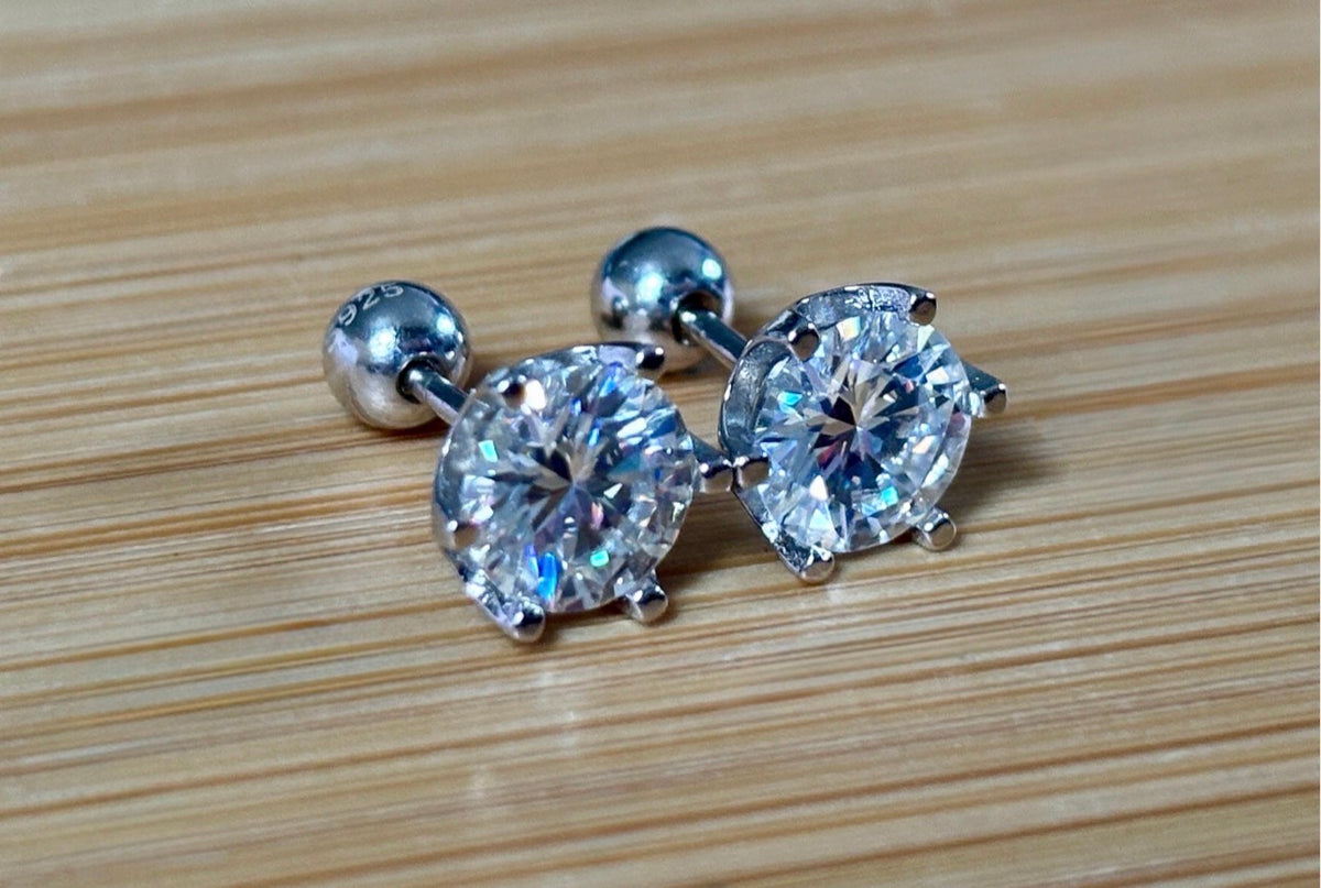 A certified pair of pretty, floral-inspired 2cttw or 4cttw Moissanite studs in poinsettia-shaped settings w/screwball backs OR 4cttw w/push backs!