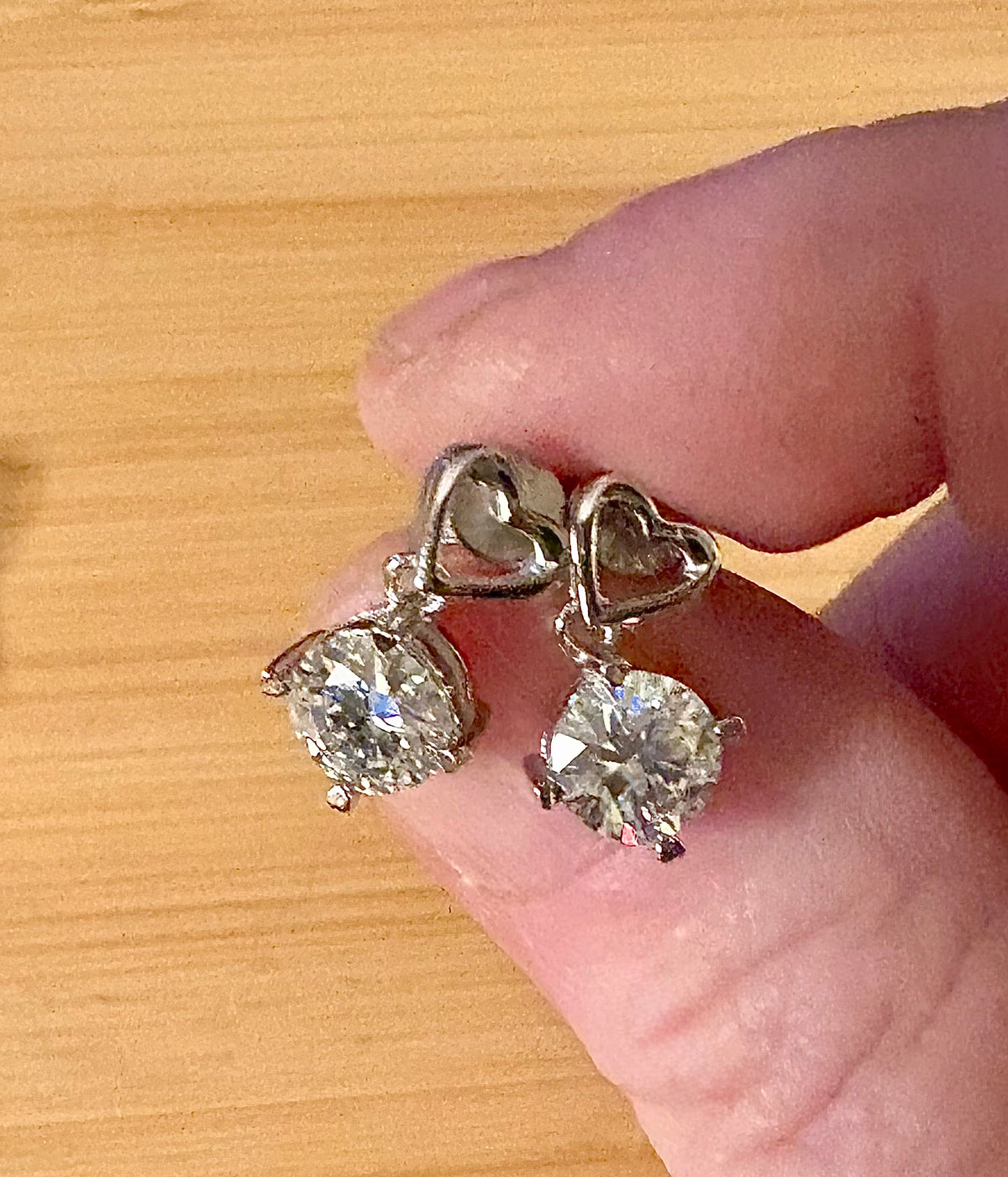 Moissanite earrings. Certified 2cttw round brilliant Moissanites dangling from heart-shaped posts are perfect for your Valentine (or you)!