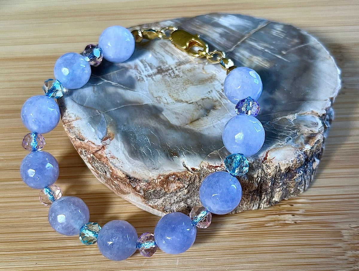 Aquamarine bracelets and/or earrings. Faceted 10mm aquamarines with your choice of crystal or stainless steel station beads and stainless steel color!