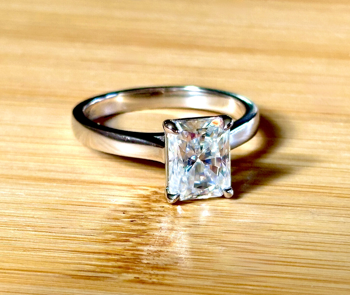 A certified Moissanite 3ct radiant solitaire! An UBER flashy, ULTRA classy, contemporary and chic radiant-cut engagement ring!